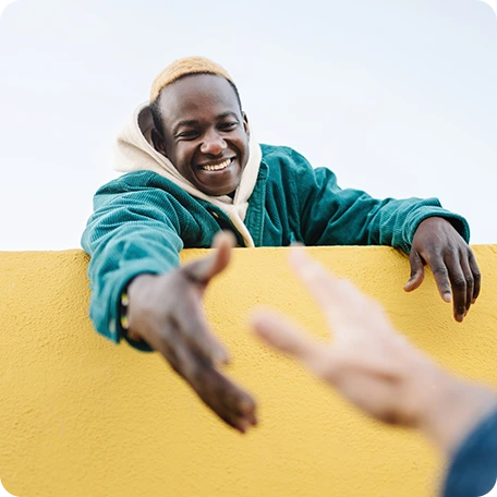 Man offering helping hand after successful treatment for severe depression in Tempe, AZ. Discover Spravato solutions.