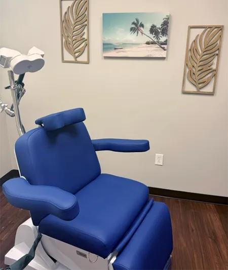 TMS therapy treatment chair and equipment at the SMHWI Rockwall clinic in Rockwall, TX